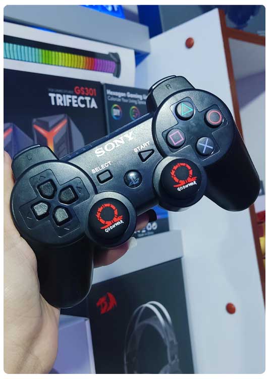 imagen-gomas-protectoras-ps3-godofwar-negro-rojo-fenixxdigital